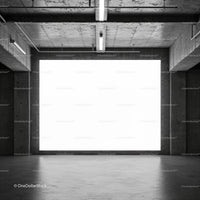 Empty Industrial Space with Large Backlit Concrete Wall