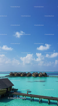 Beautiful Overwater Bungalows with Clear Turquoise Water and Blue Sky