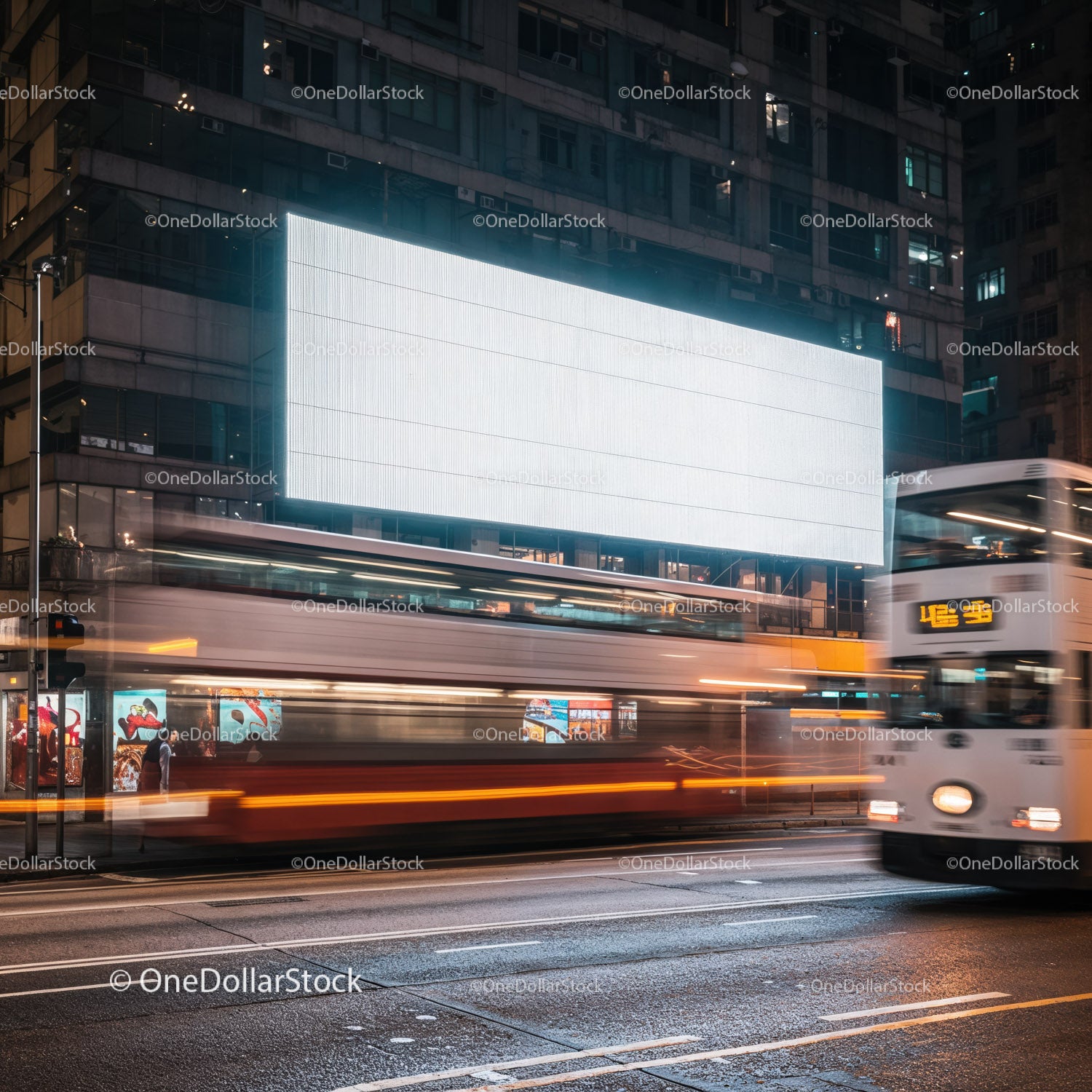 Blurred Double-Decker Buses Passing Bright Urban Billboard