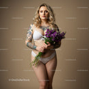 Elegant Woman with Tattoos Holding Purple Flowers in Studio