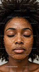 Black Woman with Curly Hair Receiving Facial Mask Treatment