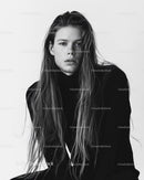 Stylish Young Male Model with Long Hair in Black and White Portrait