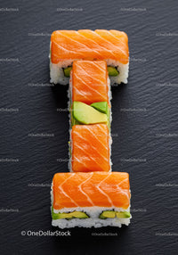 Fresh salmon sushi rolls arranged in a bold shape