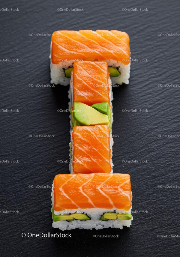 Fresh salmon sushi rolls arranged in a bold shape