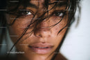 Close-Up of Woman with Intense Gaze and Wet Hair