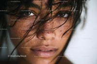 Close-Up of Woman with Intense Gaze and Wet Hair
