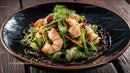 Colorful Shrimp and Vegetable Salad on Black Ceramic Plate