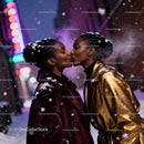 LGBTQ Couple Sharing a Tender Kiss in Winter Snowfall