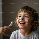Happy child enjoying whipped cream on face