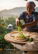 Traditional Woman Preparing Lime Peel on Fresh Handmade Tortilla