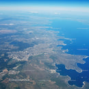 Scenic Aerial View of Coastal City with Lakes and Green Spaces