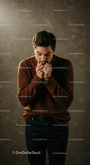 Pensive man lost in thought wearing cozy sweater