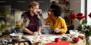 Couple Playfully Baking Heart-Shaped Cookies Together