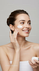 Young Woman Applying Face Cream for Healthy Glowing Skin