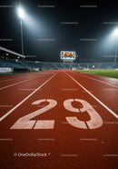 Empty nighttime running track lane 29 under stadium lights