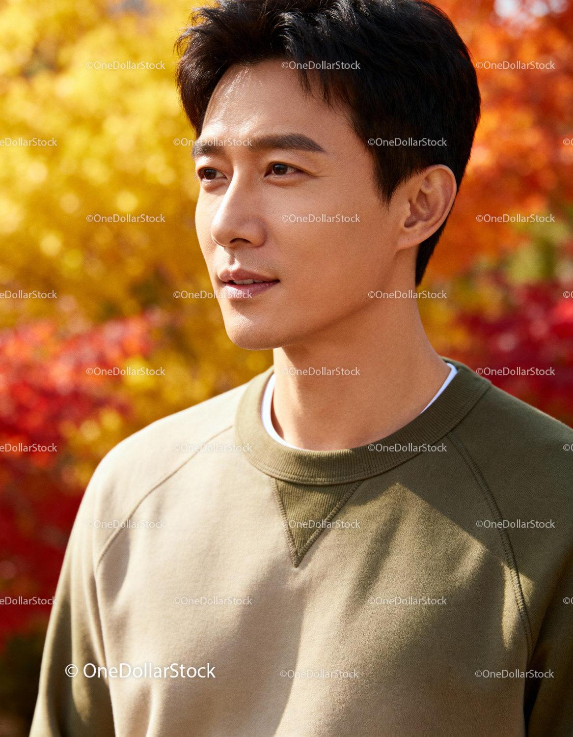 Young man enjoying peaceful autumn outdoors