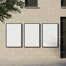 Three Blank Posters on Modern Beige Building Wall