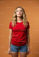 Young woman with curly blonde hair looking up thoughtfully