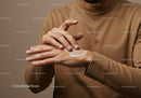 Close-Up of Man Applying Hand Lotion for Skin Moisturization