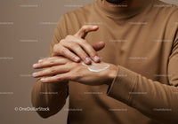 Close-Up of Man Applying Hand Lotion for Skin Moisturization