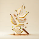 Sliced Pears with Pistachios and Cinnamon Stick Floating