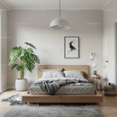 Modern Minimalist Bedroom with Monstera Plant and Black and White Bird Art