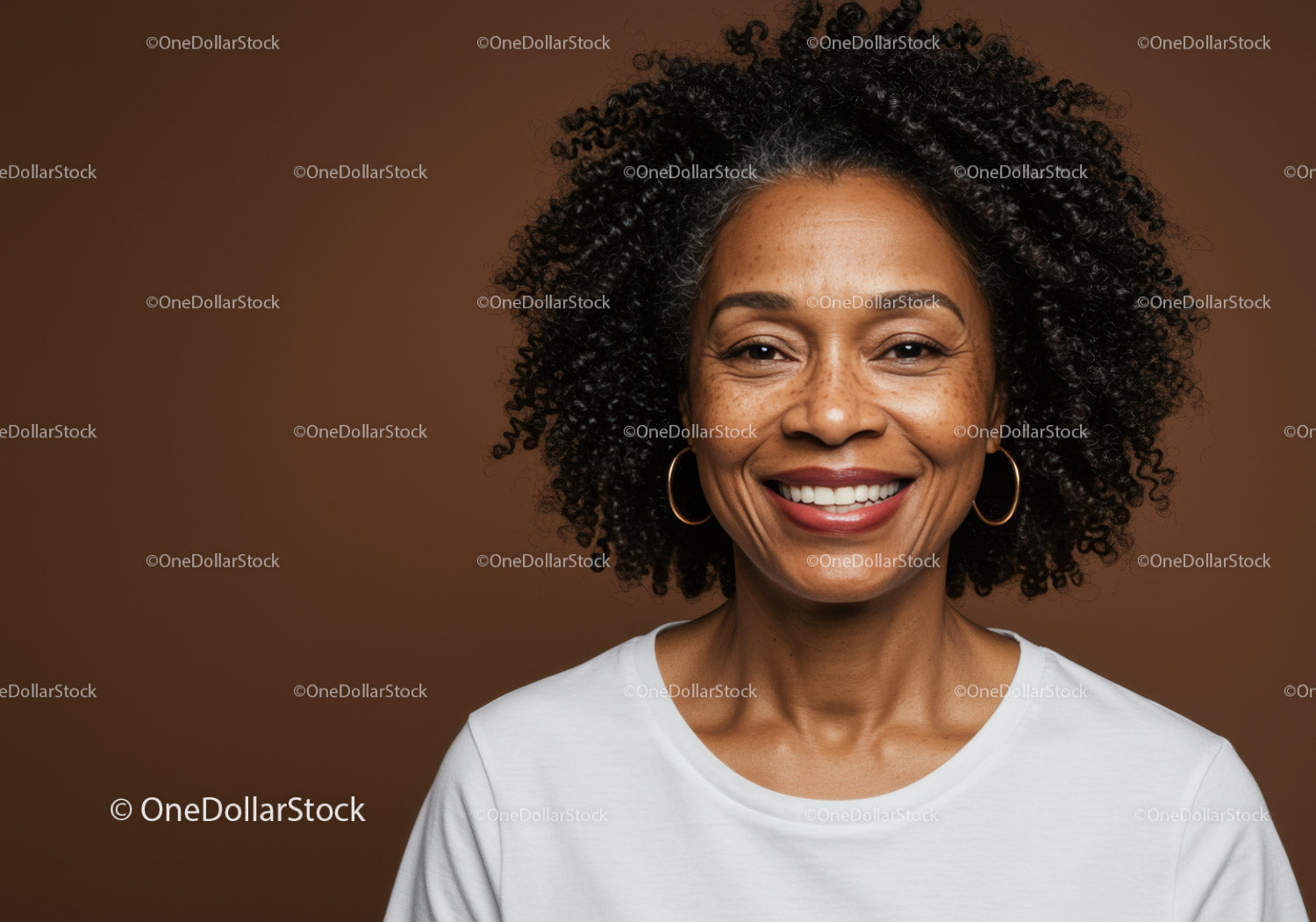 Close-Up Portrait of Smiling Woman with Curly Hair and Gold Hoop Earrings