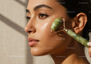 Young Woman Using Jade Roller for Skin Rejuvenation in Spa Setting