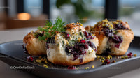 Berry Panna Cotta with Pistachios and Fresh Herbs on Black Plate