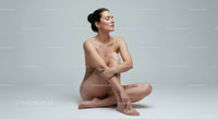 Peaceful woman meditating in serene minimalist space