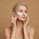 Elegant Woman Applying Skincare Cream for Youthful Glow