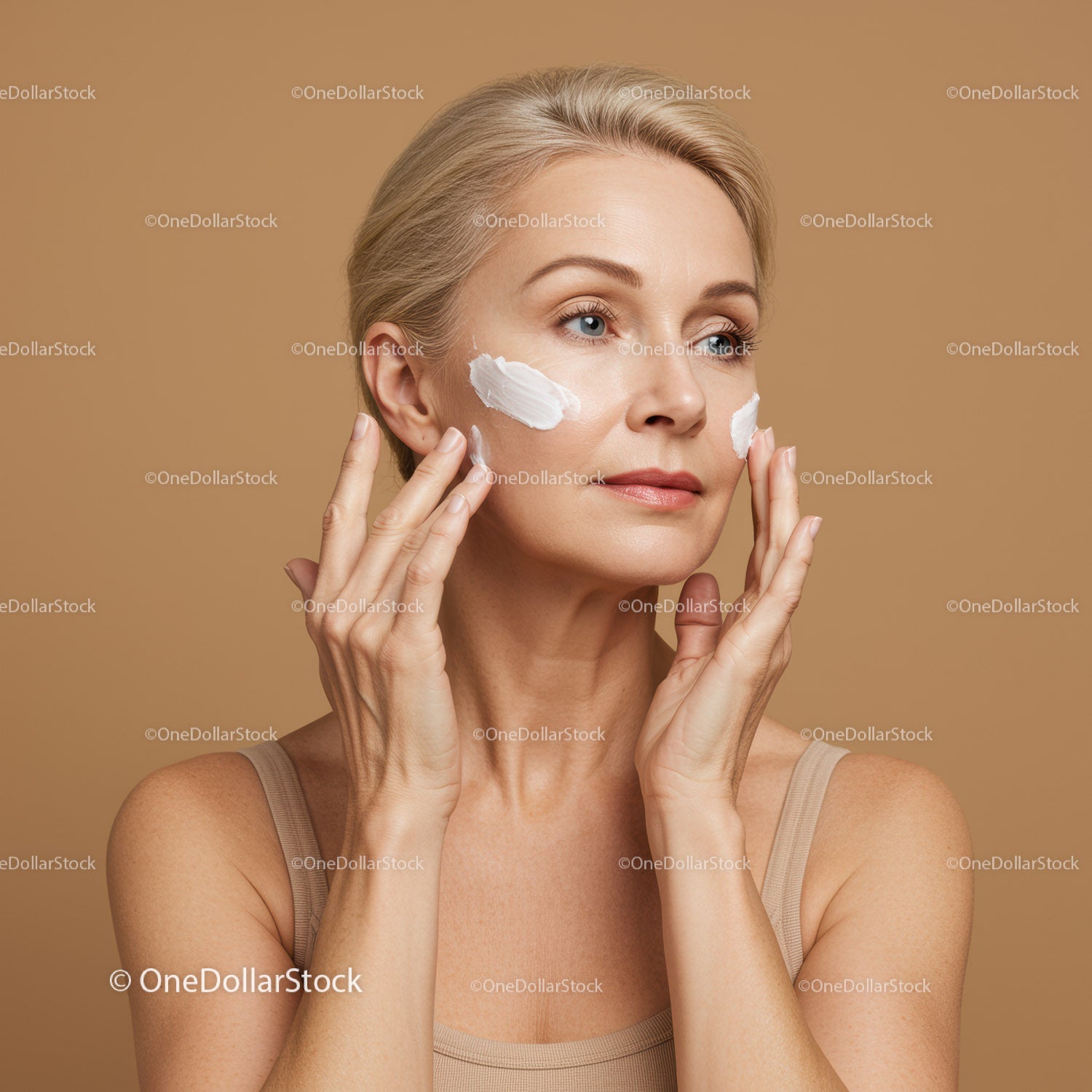 Elegant Woman Applying Skincare Cream for Youthful Glow