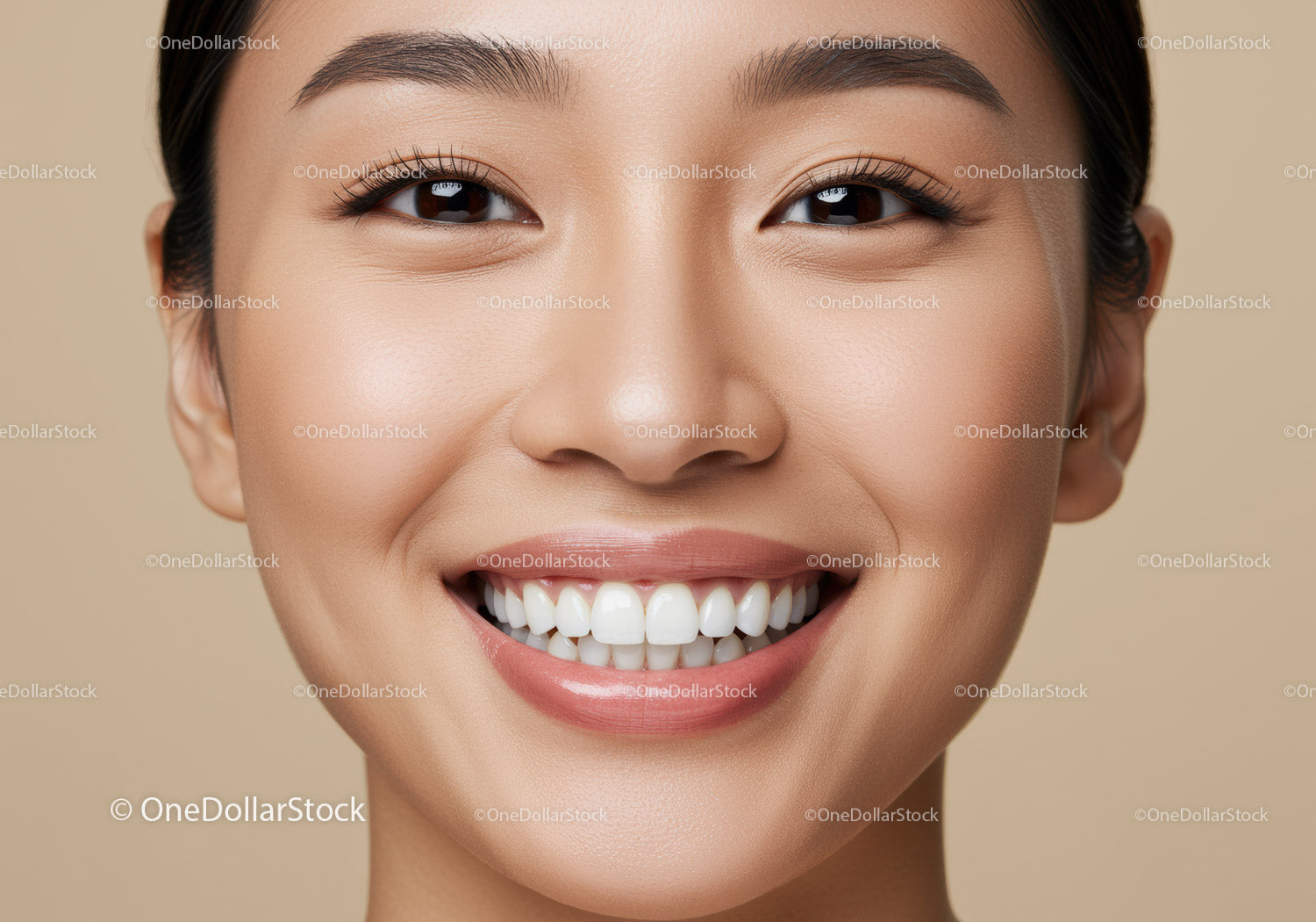 Close up portrait of smiling young woman with perfect skin