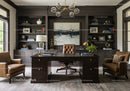 Elegant home office with leather chairs and dark wood desk