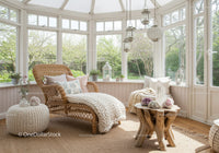 Cozy sunlit wicker lounge in a bright garden room