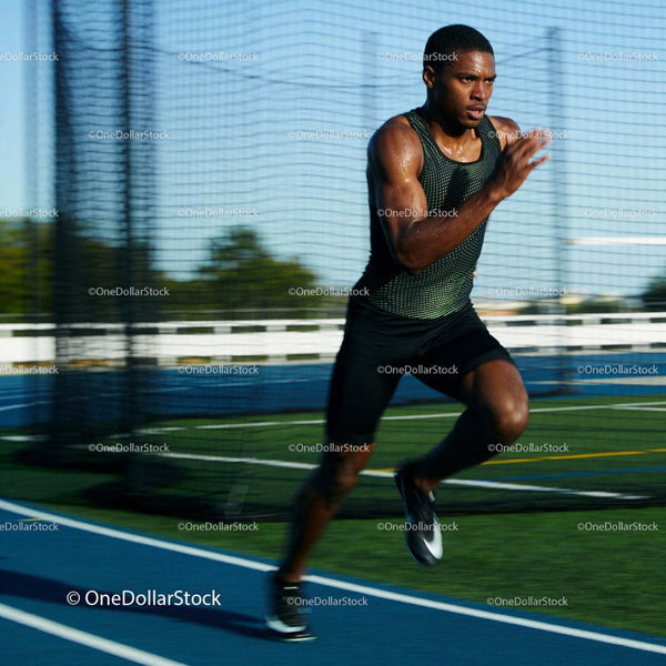 Focused athlete sprinting powerfully on outdoor track