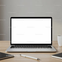 Modern laptop with blank screen on wooden desk setup