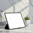 Digital Tablet with Blank Screen on Marble Surface