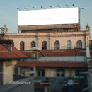 Old Building with Blank Billboard under Evening Sky