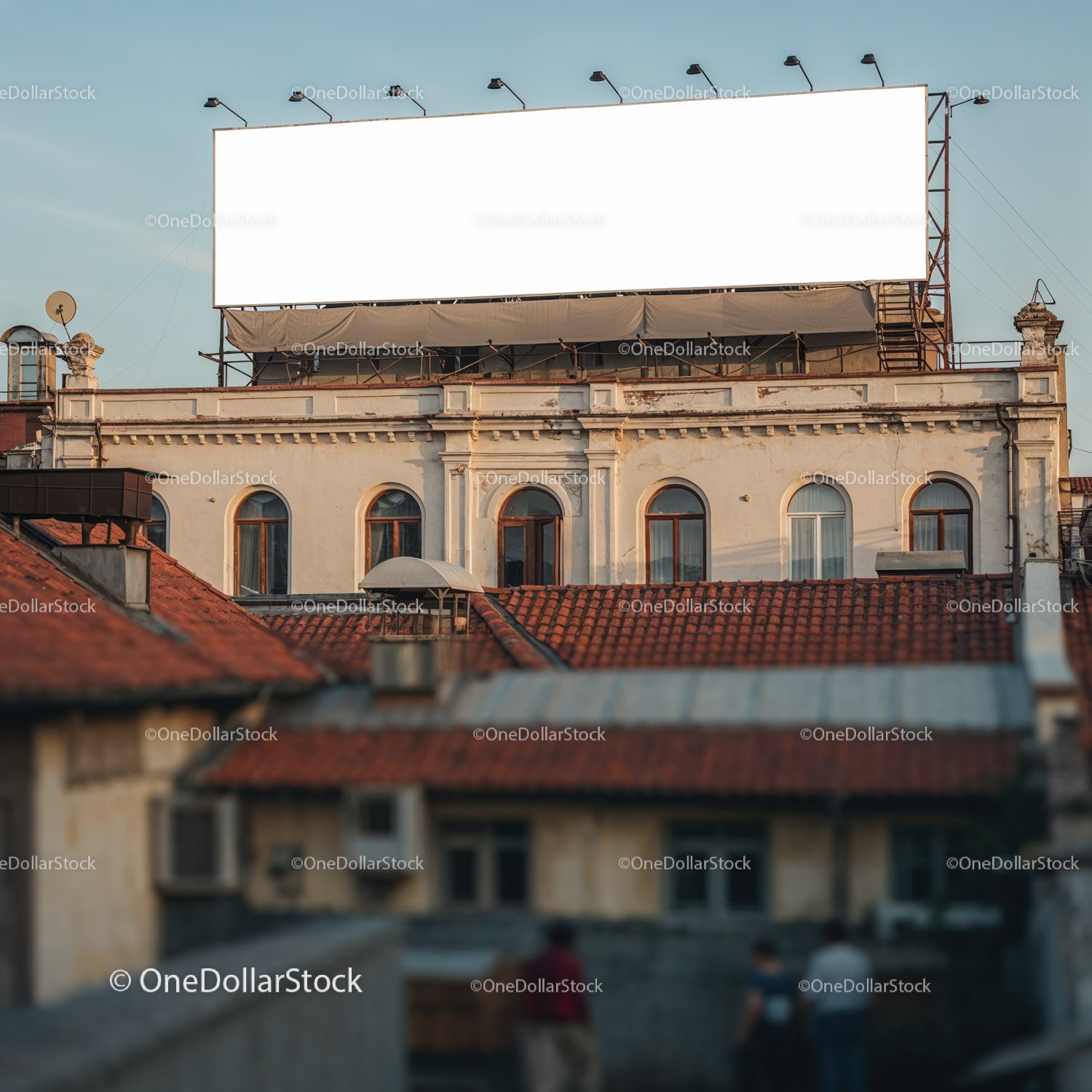 Old Building with Blank Billboard under Evening Sky