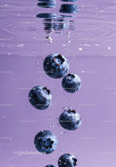 Fresh blueberries submerged in clear water bubbles