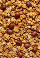Crunchy granola with roasted almonds close up texture