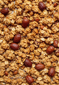 Crunchy granola with roasted almonds close up texture
