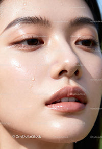 Close-up of a radiant woman with dewy glowing skin