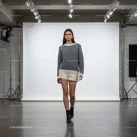 Fashion model walking in studio with casual winter outfit