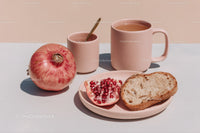 Fresh Fruit and Tea Breakfast Scene with Pomegranate and Bread