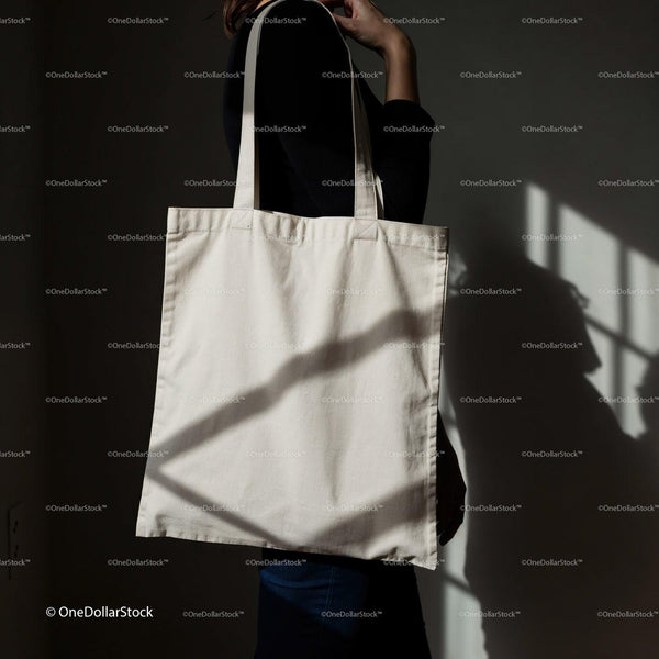 Woman Holding Plain Canvas Tote Bag in Natural Light JPG Mockup Image