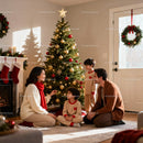 Family Decorating Christmas Tree Together in Cozy Living Room