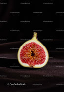 Close-up of ripe fig half on dark background