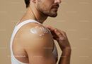 Man Applying Sunscreen Lotion on Shoulder for Skin Protection